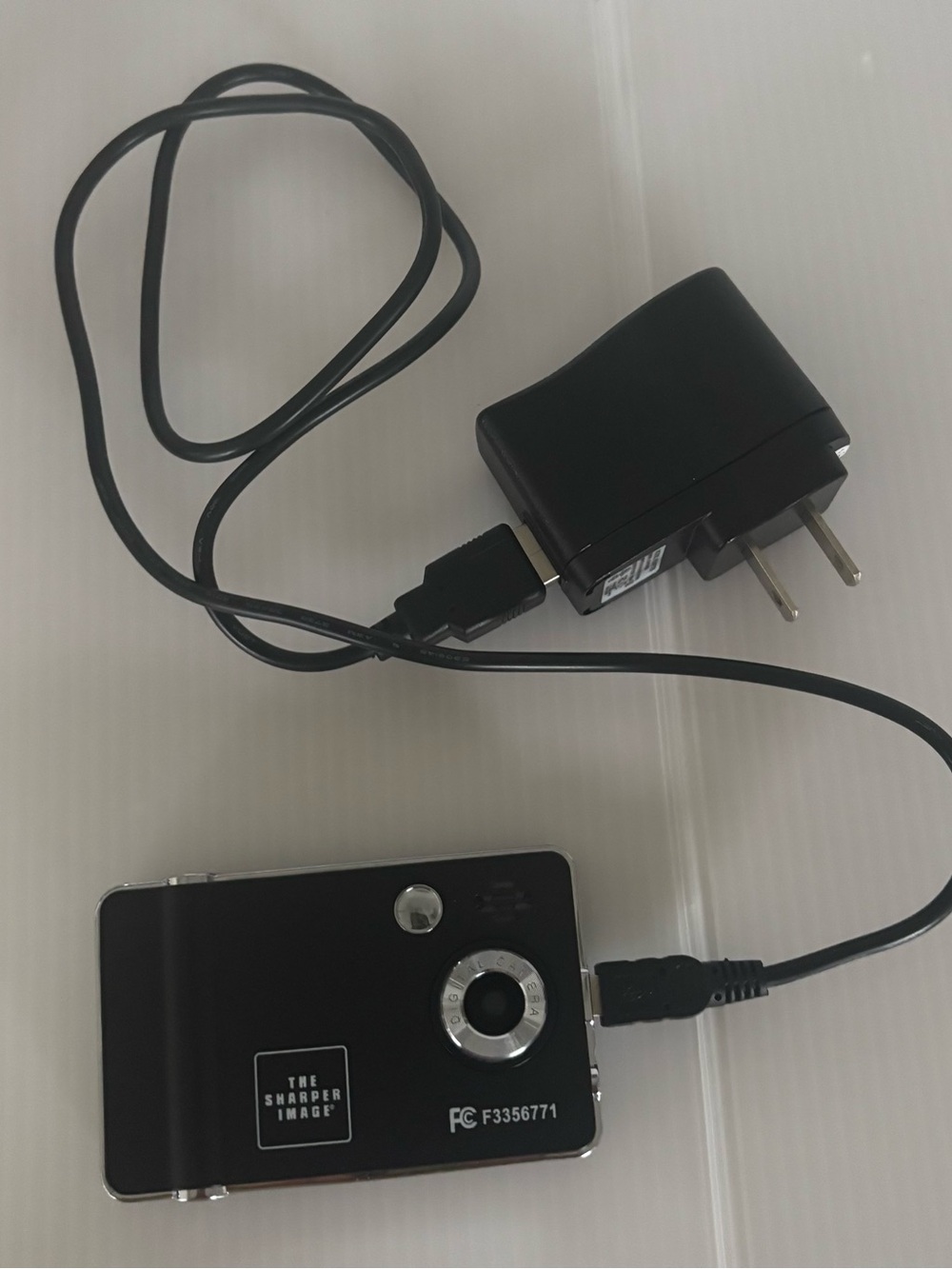 Sharper Image Black and Silver Compact Digital Camera with Charger